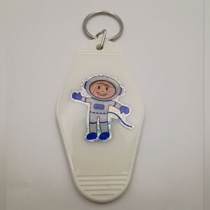 Vintage Style Astronaut Motel Keychain with White and Blue Design
